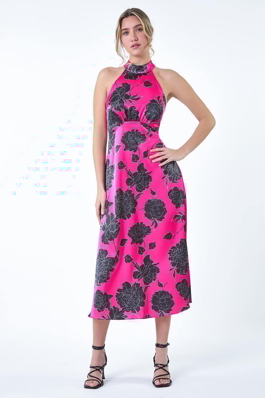 Floral Satin Look Halterneck Midi Dress from Roman. Stun your Summer party guests this season with this floral midi dress! Elevating your occasionwear with a sophisticated halter neckline and sleeveless silhouette, this woven dress skims your figure for a flattering fit with a luxe satin-feel fabric. It features an elegant empire line waist with a keyhole button and tie detail at the back, cinched in with a comfortable elasticated waist. Wear it with strappy heels for the perfect Wedding guest ensemble.