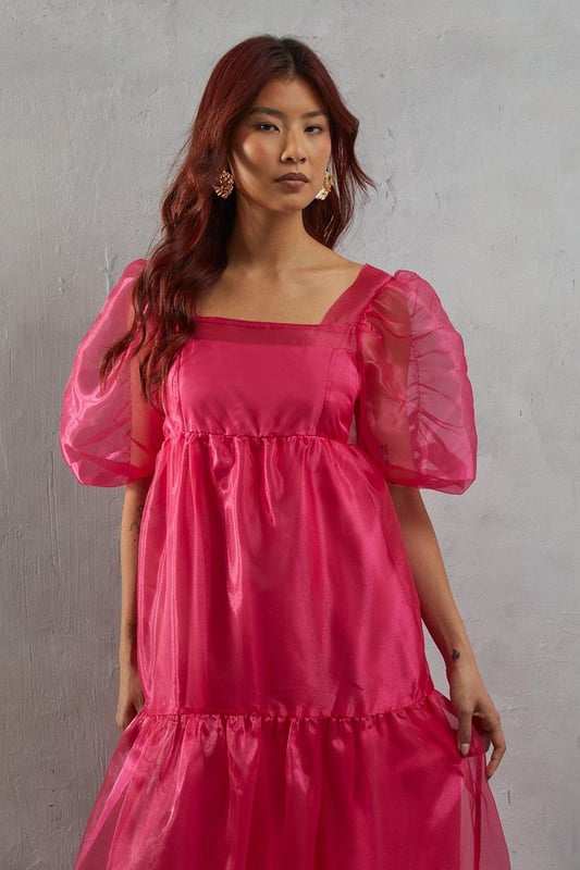Introducing our Organza Square Neck Midaxi Dress, a stunning piece that exudes elegance and sophistication. This dress features intricate detailing that adds a touch of femininity, while the long sleeves provide a modest yet stylish look.  Whether you're attending a wedding or a special event, this dress is sure to make you feel confident and glamorous.