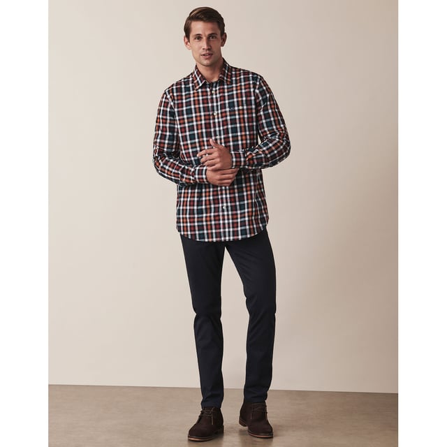 Refresh your shirt collection for the cooler months, with our poplin shirt in navy,red,white. Cut from  100% cotton in a classic fit, this button down has complementary embroidery on the chest and hanger loop. Team with chinos and desert botts for a timeless autumn ensemble.