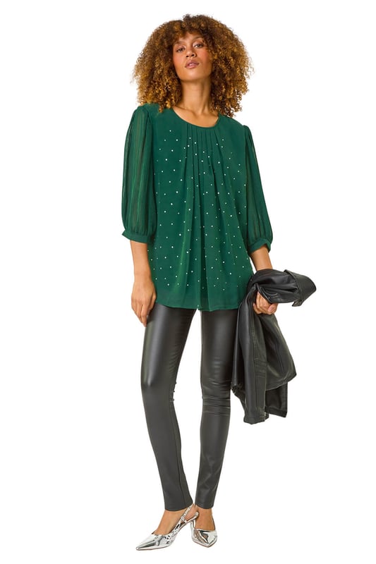 Pleated Sleeve Hotfix Detail Top from Roman. Add a touch of glamour to your Autumn/Winter wardrobe with this chic pleated sleeve top. The stylish round neck and elegant gathering at the neckline perfectly complement the eye catching all over hotfix detailing. The 3/4 pleated sleeves add a feminine touch to this versatile top. Pair it with pleather trousers and heeled boots for a party ready look that's sure to make a statement!