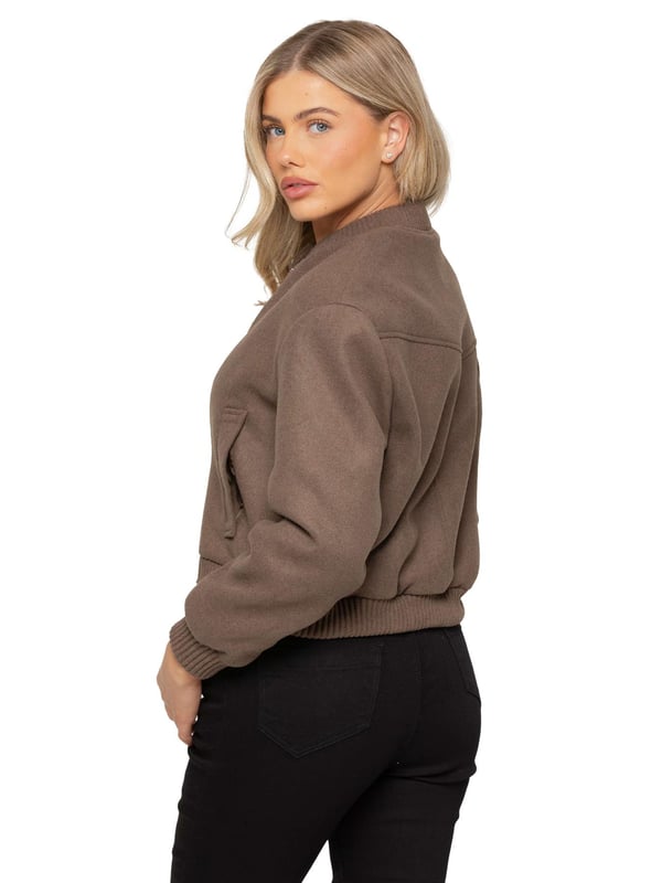 The Women's Wool Bomber Jacket features a stylish ribbed collar and cuffs, complemented by a classic button-up design. Crafted from premium soft fabric, it offers a comfortable and relaxed fit. With two functional side pockets and a cropped silhouette, this jacket blends both style and comfort effortlessly. Made from a high-quality blend of 96% polyester and 4% elastane, it's machine washable for easy care