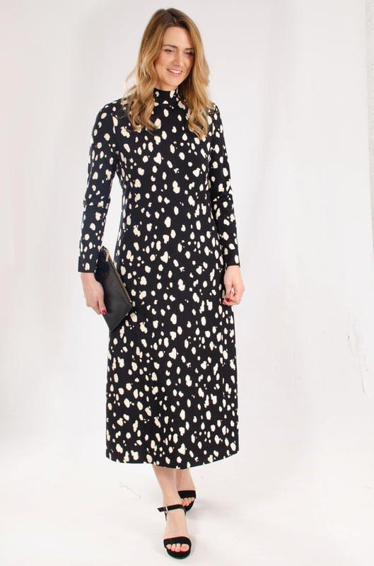 Discover timeless elegance with the Hobbs 'Alcott' Abstract Splash Dot Jersey Dress. Crafted from soft jersey fabric, this dress features a classic stand neck, long sleeves, and a chic black and cream print, making it the perfect choice for both casual and dressier occasions.