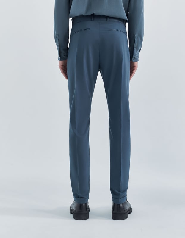 This grey trousers suit has zip and button fastening.
