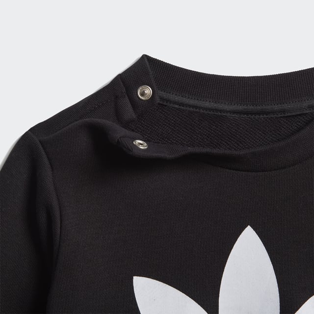Dress them up in iconic sporty style. A big contrast Trefoil logo and 3-Stripes give this infants' outfit an authentic look. Both pieces are made of a cosy, soft French terry. Hidden shoulder snaps on the sweatshirt make it easy to slip on and off.  - Regular fit is not tight and not loose, the perfect in-between fit - Ribbed crewneck - Long sleeves with ribbed cuffs; Ribbed pants cuffs - 70% cotton, 30% polyester (recycled) - Pants: Side pockets; Drawcord on ribbed waist - adidas partner with the Better Cotton Initiative to improve cotton farming globally; This set is made with recycled polyester to save resources and decrease emissions - Sweatshirt: Snap-button placket on shoulder for easy on and off (up to size 86); Ribbed hem  Shipped by adidas