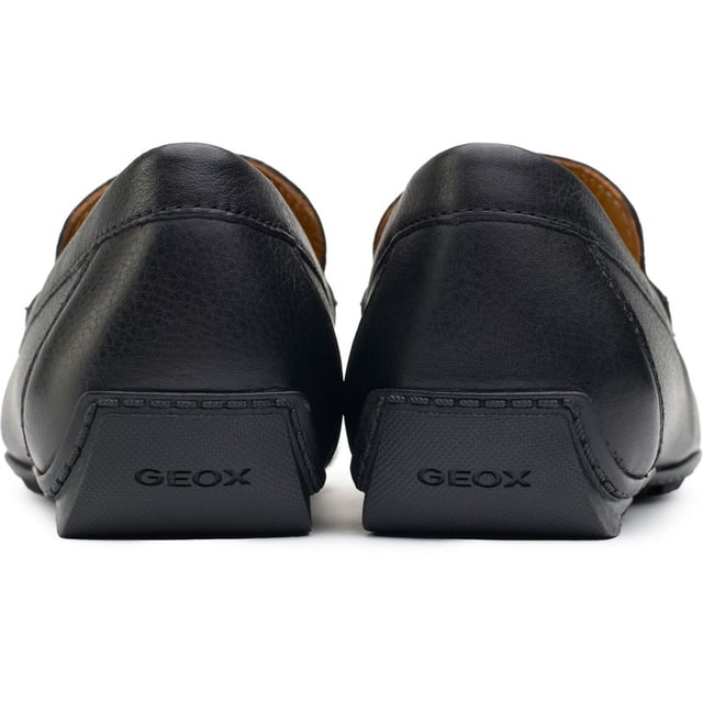 Step Into The Epitome Of Sleek Sophistication With The Geox Kosmopolis Driving Shoes. These Black Loafers Feature A Luxurious Leather Upper And A Durable Rubber Sole Tailored For Superior Grip. The Hybrid Leather And Textile Lining And Branded Leather Footbed Carry You In Comfort. Lightweight And Effortless, These Loafers Are A Seamless Blend Of Style And Practicality, Perfect For Navigating The Urban Landscape.