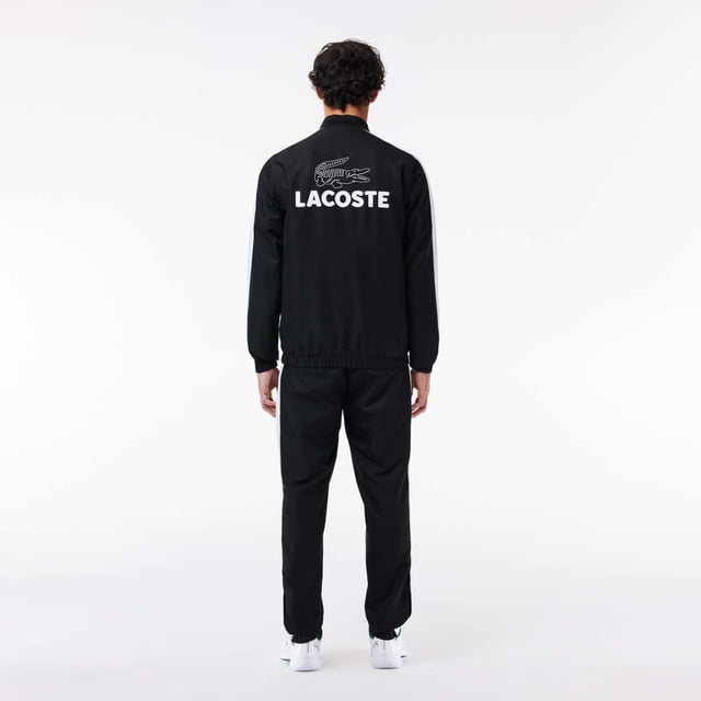 Designed for Tennis  for a regular frequency of use This poduct is made with our iconic diamond weave Taffetas. This hard-wearing fabric lends Lacoste’s tracksuits and caps a solid criss-crossed weave. Designed for freedom of movement  it is supple and lightweight  dries very quickly and doesn’t crease. This tracksuit is in 100% recycled polyester The jacket has a mesh lining and the pant a jersey lining Regular fit: natural ease on body The French Capsule offers the complete mid seasonal wardrobe on and off court with a powerful colorblocking design and its new print.