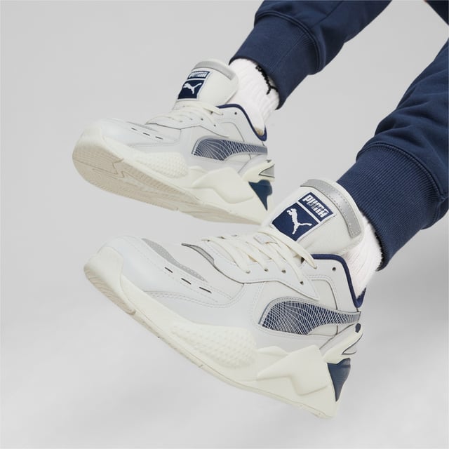 PRODUCT STORY: RS-X is back. This future-retro silhouette made waves when it dropped in 2018, celebrated for its disruptive design, fresh material mixes, and bold colors. Today, RS-X returns for a new generation of consumers who live to express their individuality. It’s here to start a revolution of self-expression. This shoe celebrates the 40th Anniversary of the RS technology paying homage to the original RS-Computer and features a mesh base with synthetic overlays, and reflective details. FEATURES & BENEFITS: Vegan certified product; The upper of the shoes is made with at least 30% recycled materials; Running System: PUMA's comfortable cushioning technology celebrates the reinvention of a unique moment and movement in culture. DETAILS: Mesh upper; Synthetic overlays; Reflective heel and reflective toe underlay; TPU heel; Mesh lining; Mesh sockliner; Platform toe; Lightweight PU midsole; Rubber outsole.