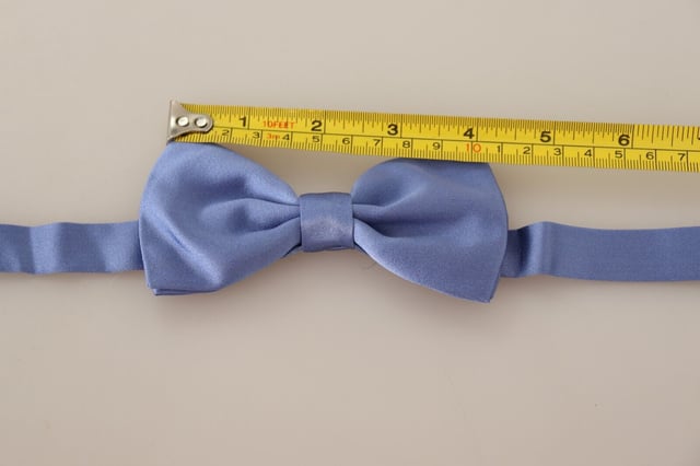 Brand: Dolce & Gabbana
  Condition: Brand New with Tags
  Color: Purple
  Style: Tied
  Material: 100% Silk
  Features a metal clasp in the form of a hook
  Adjustable length neck strap
  One size fits all
  Made in Italy
Material: 100% Silk