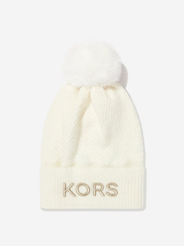 Michael Kors amplify sleek everyday wear into stylish sporty aesthetics. This girls cream pull on hat utilises the American label's modern technological properties. Made in a knit design with gold embroidery and branded in relief. She will look and feel fabulous. ‚ Knit Hat With Pompon‚ Turn Up With Gold Embroidery‚ Branded In Relief On the Front‚ Acrylic‚ Polyamid‚ Polyester‚ WoolMichael Kors : Hat Size2-3Y: 50cm 4-6Y: 52cm8-10Y: 54cm 12Y: 56cm 14Y: 58cm