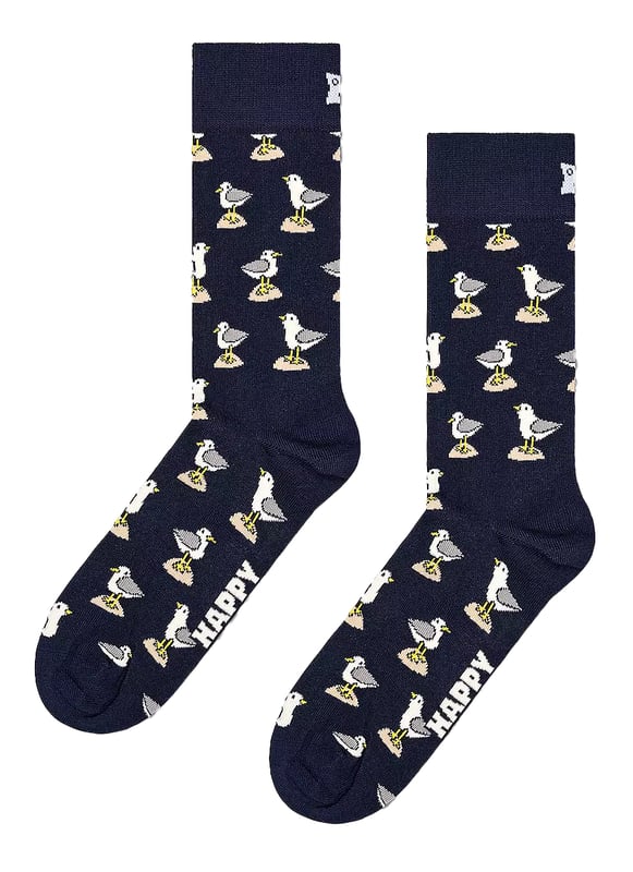 1 Pack Seagull Novelty Design Socks by Happy SocksExperience true comfort and stylish fun with the 1 Pack Seagull Novelty Design Socks by Happy Socks. With sizes ranging from 36-40 to 41-46, these versatile socks can jazz up both casual and formal outfits, thus, proving to be a savvy addition to your sock collection. Relish the supreme comfort these socks offer, a must-have for everyone.Happy Socks are designed meticulously to infuse a touch of playfulness into your everyday attire. The expert blend of comfort, style, and year-round adaptability makes these socks a versatile companion for your dynamic lifestyle. Made from a breathable blend of 86% Cotton, 12% Polyamide, and 2% Elastane, these socks provide a snug and comforting fit.1 Pack Seagull Novelty Design Socks are packed with noteworthy features. The distinct Seagull pattern uplifts the fun factor in your look while the soft, breathable combed cotton promises lasting comfort. Moreover, the reinforced heel and toe enhance durability. Get ready to dive into this perfect blend of comfort, style, and durability with these Seagull Socks - an ideal choice for premium sock wear.Extra Product Details - Fun and playful design- Premium quality material- Unique Seagull theme- Suitable for all seasons- Ideal for casual and formal settings- Available in sizes 36-40 and 41-46