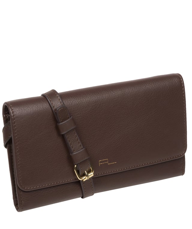 The 'Saffron' cross body clutch bag from the Pure Luxuries Marylebone collection is handcrafted from high-quality, genuine Nappa leather with a natural super-soft touch. The minimalistic fold-over top is secured by a gold-coloured magnetic press stud. The interior is lined with 100% cotton and features slip pockets and card slots to help keep an organised bag. Comes with an adjustable slim leather strap with a maximum drop length of 65cm. The strap is also removable by releasing the two interior press studs, transforming the bag into a clutch bag. Furnished with gold-coloured metal fittings. The minimalist Pure Luxuries logo is embossed in gold foil for a beautifully simple finishing touch.
