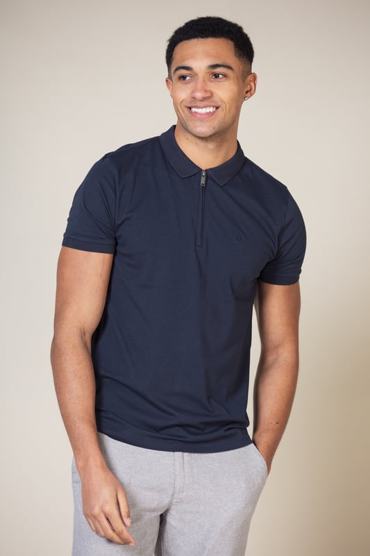 Stay stylish with this polo shirt by Nines Collection. This shirt is a classic design and features a zip fastening at the neck, knit detail collar and Nines branding on the chest. Made from 100% cotton pique fabric to ensure comfortable wear and easy care.