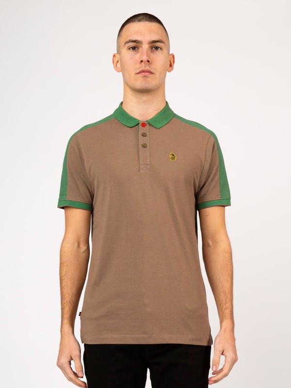 This polo shirt from LUKE is perfect for your everyday line-up. It's crafted from a soft cotton pique and detailed with contrast colour cut and sew overarm panels. It features a classic button placket which has a contrast colour underside and is complete with the brand's iconic lion head embroidery on the left chest. Iconic LUKE BLACK, GOLD, RED lion head embroidery. Iconic LUKE tri-colour trim tape. LUKE buttons. Contrast colour underside of collar. Rib collar and cuff. Single contrast cuff tipping. Contrast cut and sew overarm panels. Marina red top button..