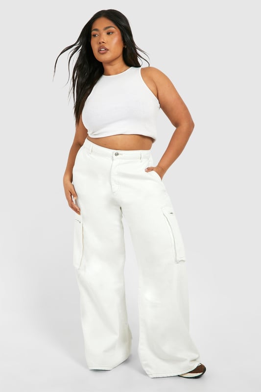 Wide-leg silhouette for a relaxed, on-trend look
        Cargo-style pockets add functional flair
        High-waisted design for a flattering fit
        Denim fabric offers durability and comfort
        Plus-size fit ensures inclusive styling
    
    Make a bold statement with these ecru cargo jeans, perfect for the fashion-forward woman who values both style and comfort. The wide-leg cut creates a relaxed silhouette that's right on trend, while the high-waisted design accentuates your curves in all the right places. Cargo pockets add a utilitarian edge, making these jeans as practical as they are stylish. Pair them with a cropped top and oversized coat for a chic, layered look that's ideal for casual outings or family gatherings. For a more laid-back vibe, team with a simple tee and trainers. The versatile denim fabric ensures these jeans will become a go-to piece in your wardrobe, easily transitioning from day to night with a simple change of accessories. Embrace the cargo trend and showcase your unique style with these must-have jeans from Boohoo.