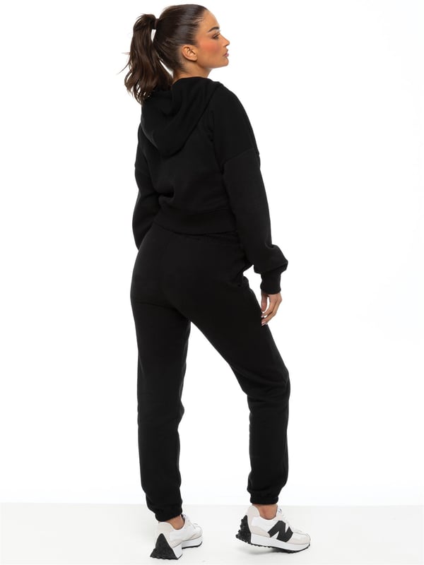 Enzo Womens Cropped Hoodie Tracksuit. Zip up sweatshirt with hood and sweatpants joggers set. Cropped hoodie and regular fit joggers with Cuffed design. Brushed back inner fleece. Cropped fit for casual wear. Essential loungewear tracksuit.
