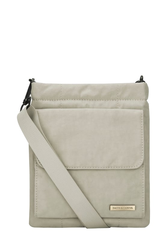 The perfect daily companion for carrying all your essentials. The Portrait Nylon Crossbody Bag features two internal main compartments, a flap over zip pocket to the front and fully adjustable strap with a clip off function. Features: , Zip top opening, Front flap over zip pocket, Rear zip pocket, SMITH & CANOVA antique brass logo, Branded antique brass zips, Adjustable crossbody strap (detachable), Two internal main compartments, Internal zip pocket Style Ref: 92685 STONE