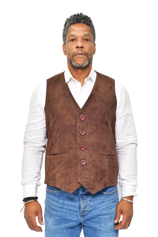 Finished in our butter soft goat suede, this waistcoat is a lightweight garment that boasts a clean and traditional aesthetic. The coat front is fastened up to a v neck with five buttons which are each colour coordinated with the waistcoat body to ensure a slick looking aesthetic. We’ve also kept this waistcoat as comfortable as possible by adding an adjustable waist that maintains a slim fit and for added practicality, we also have introduced two besom pockets at the waist. • Crafted from ultra-soft goat suede leather • Two besom pockets on waistcoat front • Features a V neckline and five buttons for fastening the waistcoat front