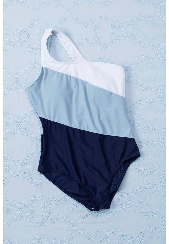 Stylish and trendy one-shoulder design
  Backless feature adds allure
  Color block pattern for a visually appealing aesthetic
  Made with Quality materials
  Comfortable and durable
  Perfect for lounging by the pool or taking a dip in the ocean