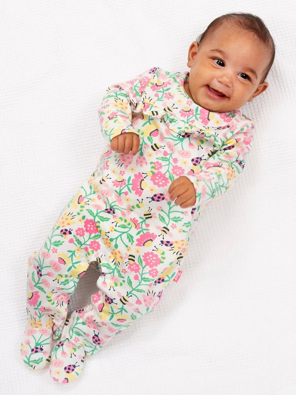 95% organic cotton 5% elastane | Proud to be certified to the Global Organic Textile Standard (GOTS) | Love nature all-over print | Single jersey with a little bit of stretch (180-190 gsm) | Popper crotch and shoulder opening | Long sleeved | Integrated scratch mitts up to 6 months | Gathered yoke design | Made in Turkey | Machine washable at 40 degrees, or at 30 degrees to be kinder to the planet