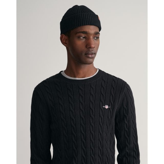 Designed in a soft cotton all-over cable knit, this sweater features our classic GANT shield embroidered at the chest, and ribbed endings at the hem and cuffs. A cable knit sweater adds a dimension of texture to your ensemble and pairs well with jeans and pants alike.
Regular fit  Crew neck  GANT graphic embroidered at chest
 
Cotton 100%
 
8050601
 
 