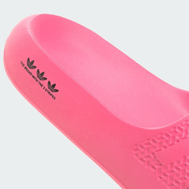 The moment you step into these adidas Adilette Ayoon Slides, you're at ease. That's the whole point of them. They let you bring the comfort of home with you anywhere, thanks to the super soft one-piece EVA foam build. That minimalist approach extends beyond the construction — the colours also keep things toned down, which happens to mean that they also style well with everything.  - Slip-on - EVA upper - Ultra-soft feel - EVA outsole  Shipped by adidas