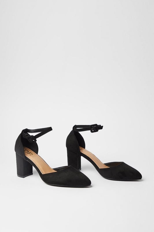 Pointed toe design for a sleek, elongating effect
        Covered block heel for stability and comfort
        Ankle strap with adjustable buckle closure
        Wide fit construction for enhanced comfort
        Versatile high heel height between 7 and 9cm
    
    Step out in style with these versatile court shoes, perfect for the fashion-forward woman who values both comfort and elegance. The wide fit construction ensures a comfortable wear throughout the day, while the pointed toe adds a touch of sophistication to any ensemble. Whether you're heading to the office or meeting friends for brunch, these shoes effortlessly transition from day to night. Pair them with tailored trousers and a crisp blouse for a polished work look, or dress them up with a flowing midi skirt for evening drinks. The ankle strap adds a secure fit and a trendy touch, making these shoes a must-have for your wardrobe. Ideal for various occasions, from baby showers to dinner dates, these court shoes offer the perfect blend of style and practicality for the modern woman.