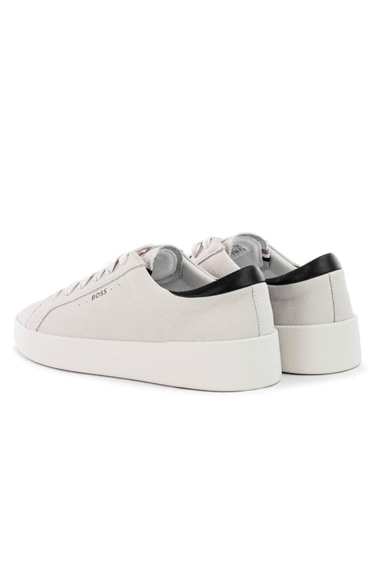 Elevate your footwear collection with these iconic lace-up trainers from BOSS Menswear. Crafted from premium polished leather, they offer a sleek and sophisticated look. The subtle logo details add a touch of signature BOSS style.
Committed to sustainability, BOSS sources a minimum of 60% of the leather used in this product from certified tanneries, ensuring a more responsible and ethical approach to production.