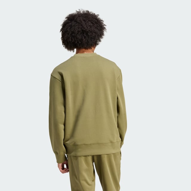 Kick off the day feeling, and looking, your best. A sleek answer to cool weather, this adidas hoodie wraps you up in plush organic cotton with plenty of room to move. Pull it on and go make things happen. This sweatshirt is made with natural and renewable materials as part of adidas' journey to design out finite resources and help end plastic waste.  - Loose fit - Ribbed crewneck - 100% cotton (organic) - Super heavyweight - Ribbed cuffs and hem  Shipped by adidas