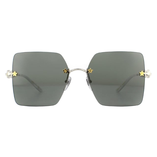Gucci Sunglasses GG0644S 001 Silver Greyare incredibly glamorous with the large rimless square lenses set into the frame with star details screws. Leage crystal feature down the temples alongside the GG logo to great effect..