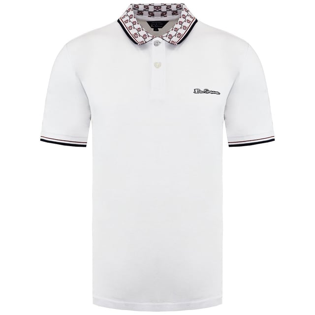 Ben Sherman Collar Interest Men's White Polo Shirt, a sophisticated and contemporary take on the classic polo shirt. With its unique collar detailing, this shirt adds a touch of interest and modern flair to your outfit, making it a versatile and stylish addition to your wardrobe.

Key Features:

 Premium Quality Material:  The Ben Sherman White Polo Shirt is crafted from high-quality cotton fabric, offering exceptional comfort, breathability, and a soft feel against the skin. Experience the luxury of superior craftsmanship with every wear.

Collar Interest Design:  The defining feature of this polo shirt is its collar interest detailing. The unique collar design adds a stylish and modern twist to the classic polo silhouette, making it stand out from traditional designs.

Timeless White Color:  The crisp white hue exudes elegance and versatility, making it a suitable choice for a wide range of occasions. Whether you dress it up or down, this polo shirt complements various styles and outfits.

Flattering Fit:  Designed with a tailored silhouette, the Ben Sherman Polo Shirt enhances your physique while ensuring comfortable movement. The three-button placket allows for easy adjustments to achieve your desired fit.

Embroidered Brand Logo:  The discreetly embroidered Ben Sherman logo on the chest reflects the brand's heritage and commitment to quality, ensuring an authentic and genuine product.

Smart-Casual Versatility:  This collar interest polo shirt can be effortlessly paired with jeans, chinos, or shorts, allowing you to create a variety of smart-casual looks for different occasions.

All-Season Wear:  Designed to be worn throughout the year, this polo shirt adapts to different weather conditions, ensuring you look refined and fashionable year-round.