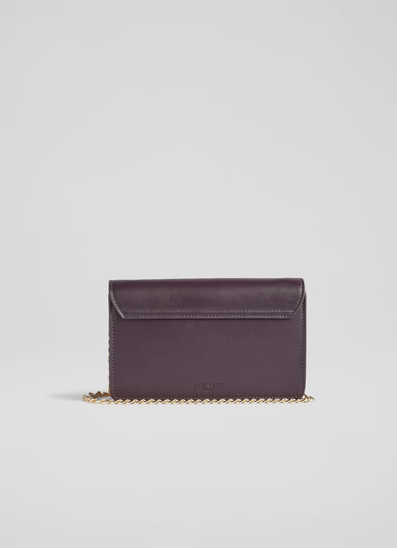 Designed to go smart, casual and all those marvellous moments in-between, the new Otto shoulder bag in our LKB Conscious collection does them all. Crafted from soft and supple vegan apple leather* in a rich shade of Bordeaux, it has a simple fold-over design with a chic gold clasp, a removable gold chain shoulder strap and apple leather wrist strap. Inside there's a handy mirror and a zip across section. Hang it over your wrist, wear it over your shoulder or hold it like a clutch, Otto is very versatile.