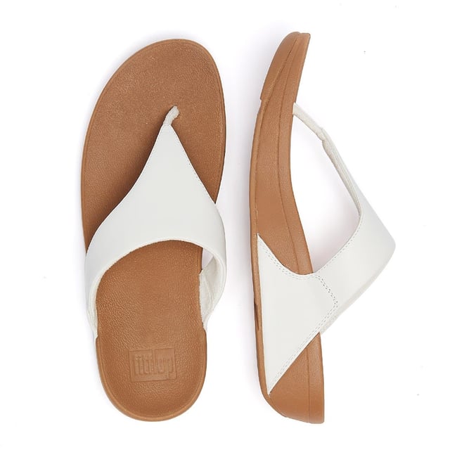 The minimalist Lulu sandals from FitFlop feature a timeless fabric-lined triangular vamp, along with legendary ergonomic Microwobbleboard™ midsoles, which deliver extraordinary comfort by not only absorbing shock but by diffusing underfoot pressure. This iteration boasts softly padded leather uppers for a classic finish.