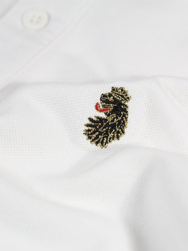 Complete your everyday look with this polo top from LUKE. Crafted from a luxury cotton pique, it's cut to a relaxed fit with a three button placket and features a soft rib collar and cuff. It is complete with the brand's iconic lion head embroidery on the left