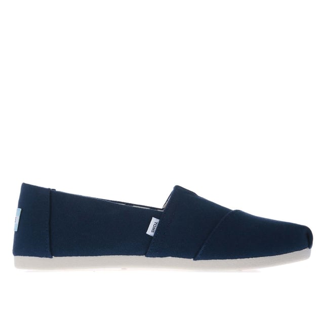Womens Toms Recycled Cotton Canvas Alpargata Espadrille Pumps in navy.- Recycled cotton upper  lining and sock-liner made with 50% recycled cotton.- Classic Alpargata design.- Toe-stitch and elastic V for easy on and off.- Chevron patterned canvas lining.- Custom insoles made with 50% eco content including recycled PU foam.- Direct injection outsole for flexibility and durability with tread pattern for improved traction.- Toms branding to side and back of heel.- 100% vegan construction.- Textile upper  Textile lining  Synthetic and textile sole.- Ref:10017712