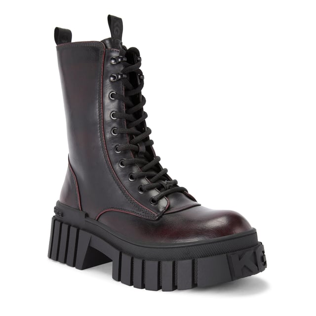 The KG Kurt Geiger Tegan Lace Up boot is a black boot with wine upper which features a KG Kurt Geiger logo printed on ribbed textile with print stitch detailing can be seen at the tongue as well as a black rubber monocle on the tongue.