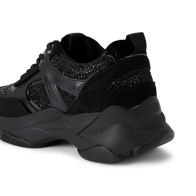 This KG Kurt Geiger Lucile Lace Up Gem sneaker is a chunky black style with crystal embellishment across the upper. The branding details are in a chic gunmetal and the exaggerated sole is in black rubber.
