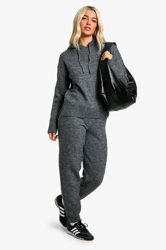 Cosy fine-knit tracksuit for ultimate comfort
        Hoodie features a relaxed fit with ribbed cuffs and hem
        Matching trousers with tapered leg for a sleek silhouette
        Versatile two-piece set for mix-and-match styling
        Soft-touch fabric blend for warmth and flexibility
    
    Embrace laid-back luxury with this fine-knit tracksuit, perfect for those days when comfort is key. The relaxed-fit hoodie pairs seamlessly with the tapered-leg trousers, creating a coordinated look that's both stylish and practical. Ideal for casual outings, this versatile set can be dressed up or down to suit your mood. Layer the hoodie over a simple tee and pair the trousers with trainers for a quick coffee run, or wear the set together for a cosy night in. For a sportier vibe, team the trousers with a cropped top and add a denim jacket for an effortless street-style ensemble. The soft-touch fabric ensures all-day comfort, making this tracksuit a go-to choice for weekend lounging or casual catch-ups with friends.