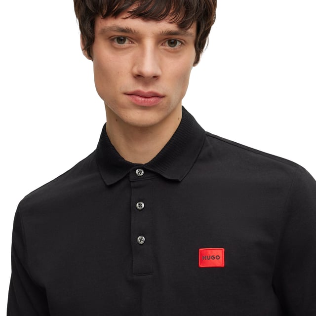 Men's polo shirt from the HUGO brand. Plain-coloured pique polo with woven label on the left chest. Made of pure cotton.
