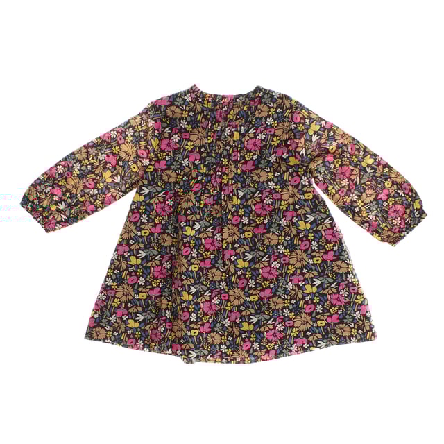 This bohemian style dress is the perfect combination of style and functionality.

 Its cheerful floral print runs throughout the garment, providing a vibrant and natural touch.

 The round neckline with Henley-style button placket gives it a casual, practical feel, while delicate ruching at the front adds a romantic, textured detail.

 Long sleeves with elastic cuffs provide comfort and a flattering fit.

 Additionally, the dress features two discreet side pockets, offering a practical touch, and is fully lined, ensuring added comfort and opacity.

 Ideal for any occasion, it combines bohemian style with functional details that make it perfect for everyday wear.
 Composition: Exterior: 100% Cotton; Interior: 100% Cotton
 Care:
- Machine wash max 30ºC and delicate cycle.
 - Use mild detergents.
 - Use dryer at low temperature.
 - Iron at low temperatures.
 - Do not dry clean.