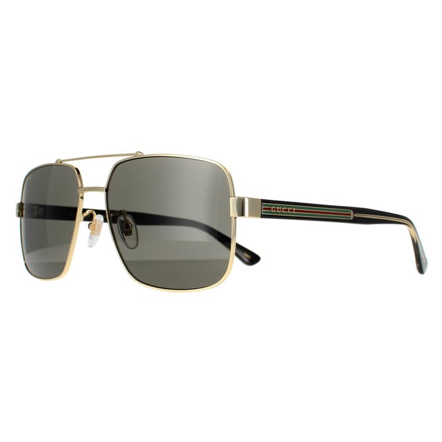 Gucci Square Herren Gold Schwarz Grau GG0529S Gucci ist eine quadratische Pilotenbrille mit dem typischen Doppelsteg-Look und schlanken Acetat-Bügeln mit dem Gucci-Logo und den Farbstreifen der Marke