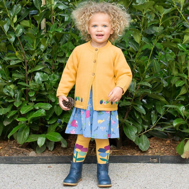Super-soft organic cotton tights that look as good as they feel. The gorgeous design in ochre yellow, features our rainbow flower and also puts in a special appearance on the seat (up to and including size 2-4y only). The perfect accessory for this season's Kite dresses, skirts and more.