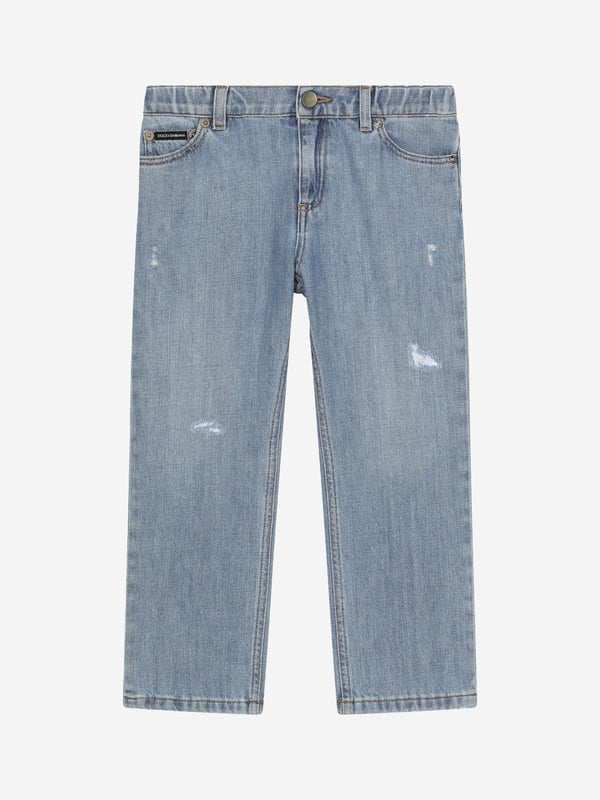 Dolce & Gabbana utilise new technological properties to create captivating aesthetics. These boys regular jeans are part of the FW24/25 Boy‚  Collection. A cool, laidback collection that boasts a ‚Äúcalligraphic-naturalistic‚Äù Majolica accent. Crafted in a 5-pocket cotton denim jeans with branded metal tag and rips. He will be obsessed. Made in Italy Denim Oversize Fit Belt Loops On Waistband Inner Waistband With Adjustable Elastic Zipper and Branded Metal Button Fastening Branded Label On Coin Pocket 100% Cotton