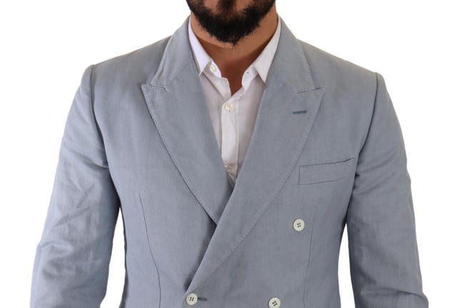 Brand: Dolce & Gabbana
  Style: Double breasted
  Fitting: Slim fit
  Colour: Light Blue
  Made in Italy
  Material: 60% Cotton 40% Flax
  Lining: 100% Viscose
  Logo details
  Very exclusive and high craftsmanship
Material: 60% Cotton 40% Flax