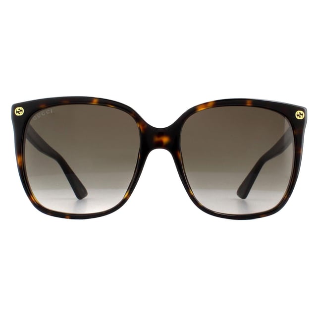Die Gucci GG0022S 003 Havana Grey Gradient Sonnenbrille hat eine einfache quadratische Form mit eleganten GG-Logos an den vorderen Tempeln und einem Bienendetail an der Tempelspitze.