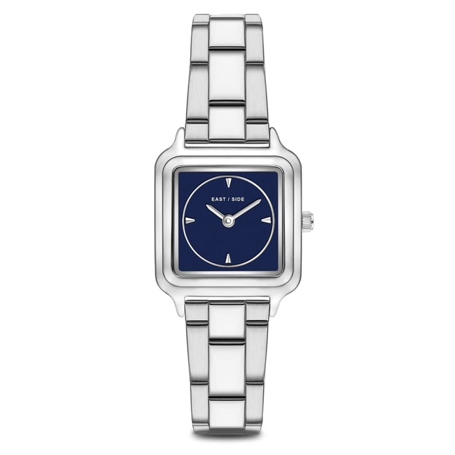 GENERAL INFORMATION:  • Targetgroup: Female  • Wristwatch: No Special Functions  • Display: analogue  • Weight of watch w/o box (gr.) - approx.: 59,0  MOVEMENT:  • Movement: Quartz  • Term of Movement: 2025  • Origin of movement: Japan  BRACELET:  • Material of bracelet/strap: Stainless steel  • Plating of bracelet/strap: None  • Finishing of bracelet/strap: Smooth  • Finishing/Decoration of bracelet/strap: None  • Clasp/Closure/Buckle: Security-folding clasp  • Color of bracelet/strap: Silver  • Length of bracelet/strap (mm) approx.: 210,0  • Width of bracelet/strap (mm) approx.: 13,8  • Style/Design of bracelet/strap: Link bracelet  • Bracelet/strap adjustable?: Yes  CASE:  • Shape of case: Square  • Size/Diameter of case in mm . approx.: 25,0 x 32,0  • Height of case in mm: 8,1  • Case material: Metal (Alloy)  • Surface of case: Polished  • Bezel/Topring: Fixed  • Finishing/Decoration of case: None  • Material of case back: Stainless steel  • Lock of case back: No screwed-in crown  • Color of case: Silver  • Coating/Plating (Case): None  • Type/Form of crystal: Flat  • Material of crystal: Mineral crystal  DIAL:  • Size jewelry care cloth: Hour, Minute  • Indices: Line indices  • Material of dial: Mother of Pearl (MOP)  • Structure/pattern of dial: Flat  • Color of dial: Blue  PUSHER, CROWN, HAND:  • Pusher: None  • Corrector: No  • Crown: No screwed-in crown  • Type of hands: Pole hand  • Luminescent (hands): No  PACKAGING & SCOPE OF DELIVERY:  • Box: Yes  • Service booklet: Yes  • Manual: Yes