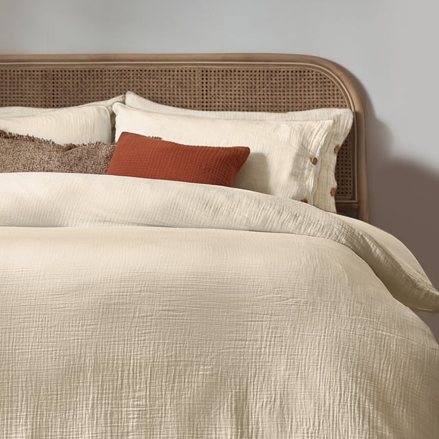 Inspired by timeless classic fabrics, the Lark duvet cover set is made from ultra-soft double-layer muslin cotton fabric. Available in a range of pastel tones, this bedding is complete with a wooden button closure. The cosy crinkle texture is perfect for bringing a relaxed, stylish feel to your bedroom. Cool and breathable in the summer months and snuggly and warm in the winter, muslin is used on both sides for an understated yet modern look. This product is certified by OEKO-TEX®, showing it has been sustainably made.