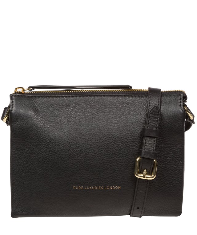 The 'Niki' cross body bag from the Pure Luxuries Marylebone collection is handcrafted from high-quality, genuine Nappa leather with a natural super-soft touch. The zip-over top opens to reveal a 100% cotton-lined interior. The spacious interor features three divided sections, a slip pocket and three card slots. The slip pocket on the rear of the bag provides on-the-go storage and comes with a matching and adjustable slim leather strap with a maximum drop length of 65cm. The Pure Luxuries logo is embossed in gold foil for a beautifully simple finishing touch.