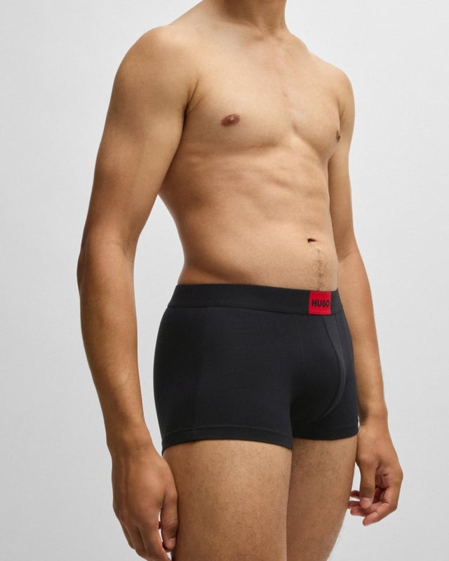 Three pairs of signature trunks in stretch jersey by HUGO Menswear. Each regular-rise pair has a HUGO logo patch on the waistband.

Packaging: Box
Exposed waistband
Regular rise

Quality: 95% Cotton, 5% Elastane, Waistband: 52% Polyamid, 33% Polyester, 15% Elastane
50532797