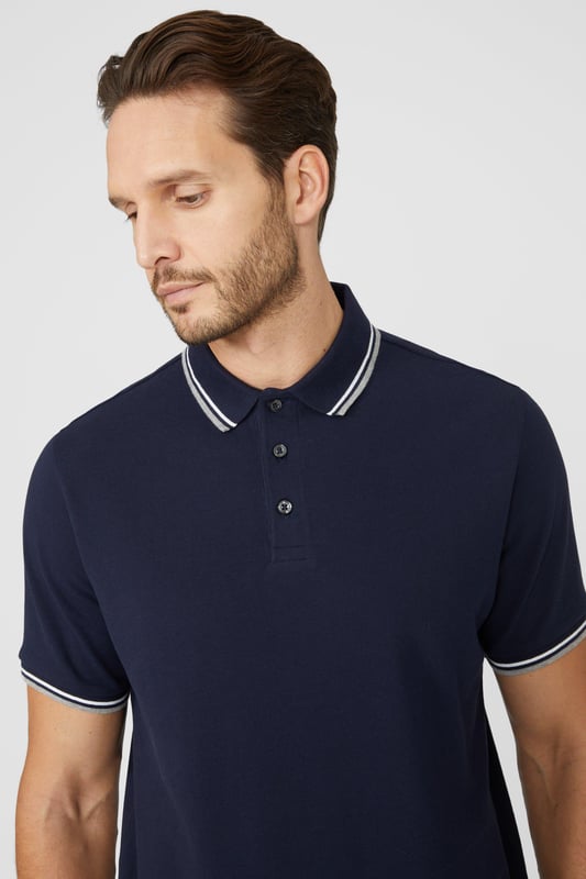 Introducing our Pique Tipped Polo, the perfect addition to any man's smart casual wardrobe. Crafted with meticulous attention to detail, this polo offers a sophisticated and polished look. The pique fabric provides a comfortable and breathable feel, making it ideal for all-day wear. With its stylish tipped collar and cuffs, this polo adds a touch of elegance to any outfit. Whether you're heading to the office or out for a casual gathering, our Pique Tipped Polo is the ultimate choice for a smart and effortlessly stylish look.