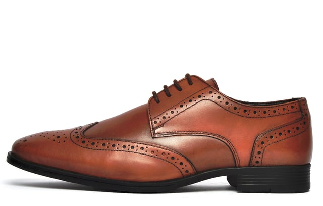 The Catesby England Bolsover is a high-end brogue that boasts outstanding style and design. With a light burnished effect, the Bolsover delivers vintage styling every time and provides the perfect mix between smart and casual and is sure to add a touch of the debonaire style to any mans outfit.
 Crafted in premium leather with intricate stitch and punch-hole detailing, these brogues boast a timeless style. A classic lace up system, durable outsole with a slight raised heel, and subtly cushioned insole complete this must-have shoes.
 - Premium leather upper
 - 4-hole lace closure
 - Intricate stitch and punch-hole detailing
 - Durable outsole  - Authentic vintage styling